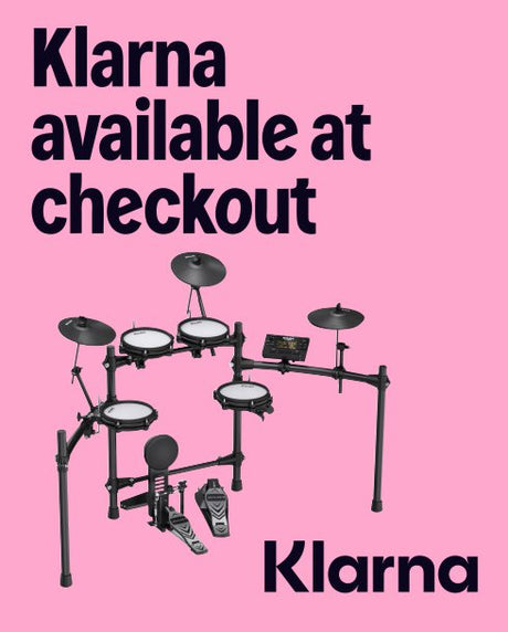 Electronic drum set on a pink background with Klarna branding.