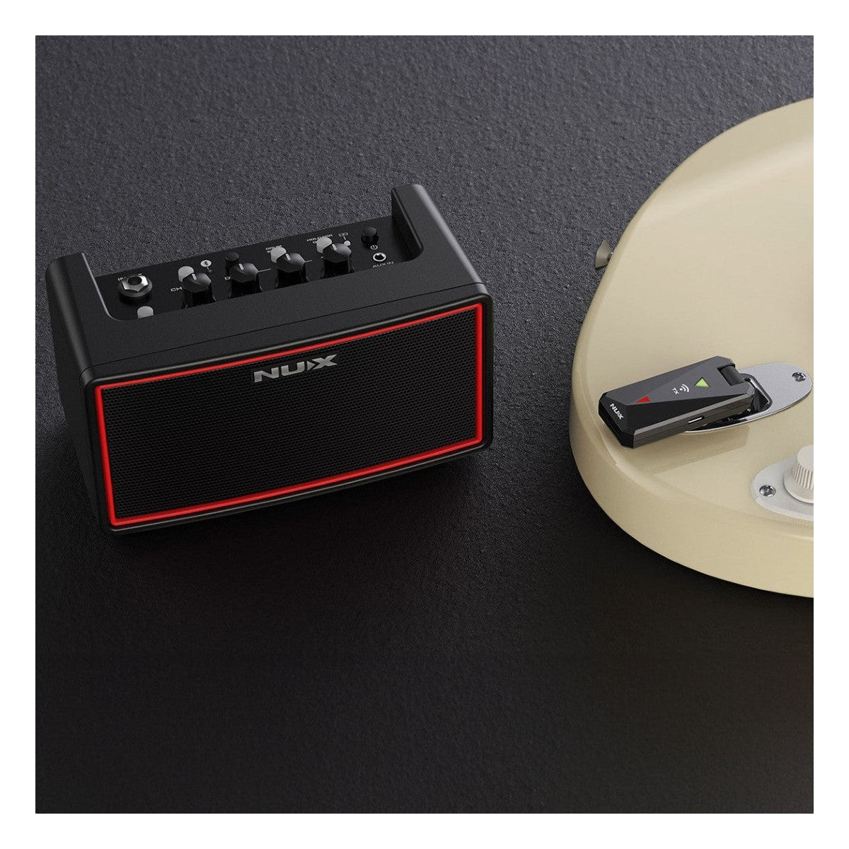 NUX Mighty Air Amplifier Lifestyle Shot with Guitar and Transmitter Unit