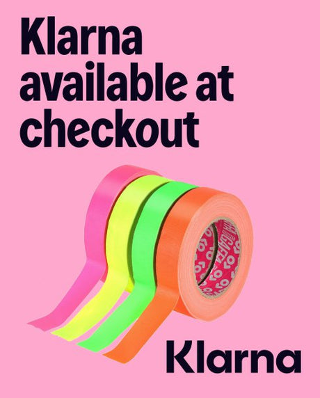 Three rolls of colorful tape on a pink background with 'Klarna' branding.