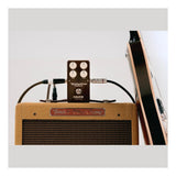 NUX 6ixty 5ive Overdrive Pedal Lifestyle Shot With Guitar and Amp