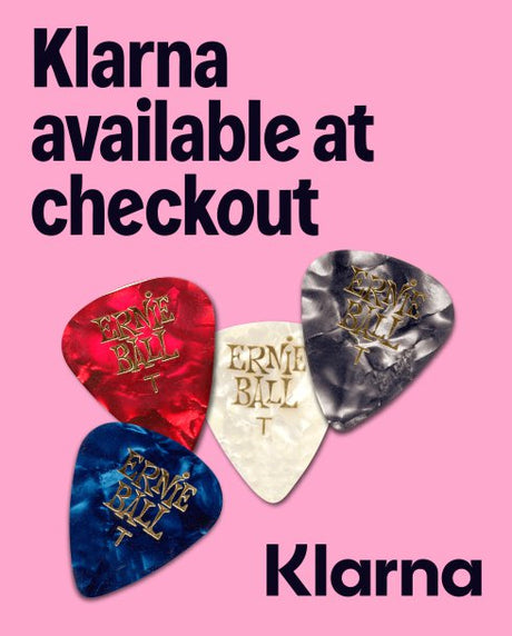 Guitar picks with 'Ernie Ball' branding on a pink background, promoting Klarna payment option.