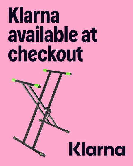 Keyboard stand with 'Klarna available at checkout' text on a pink background