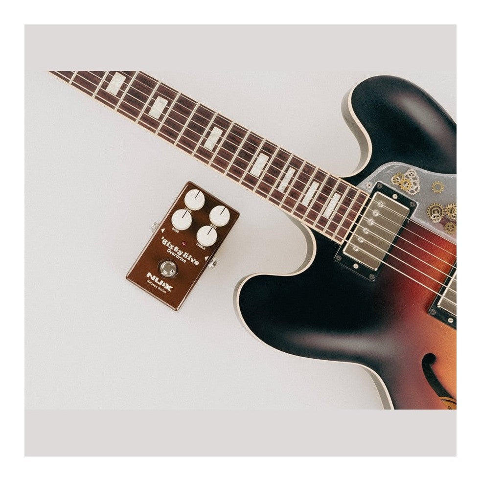 NUX 6ixty 5ive Overdrive Pedal Lifestyle Shot with Guitar