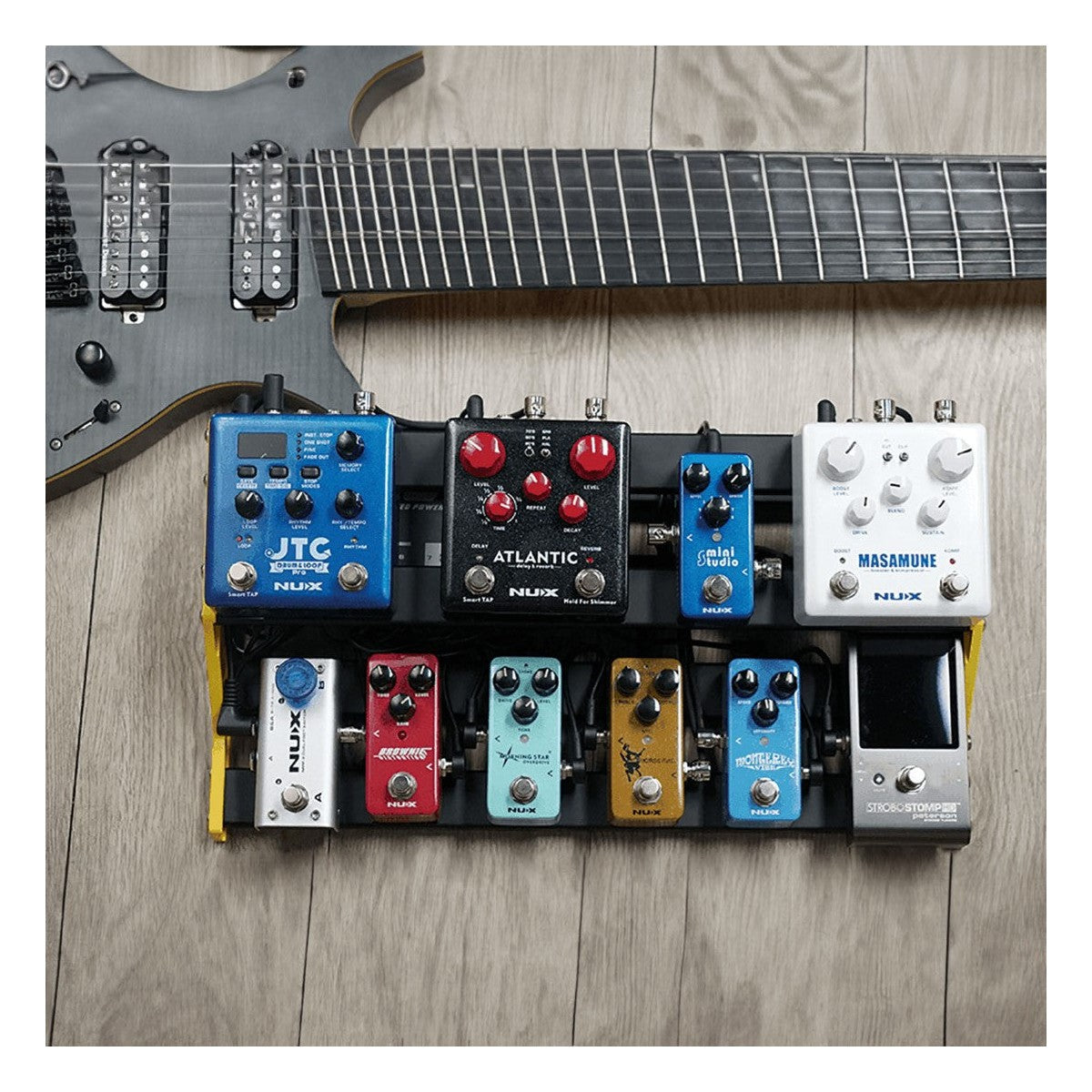 NUX NPB-L Bumblebee Pedalboard Lifestyle Shot with Pedals and Guitar
