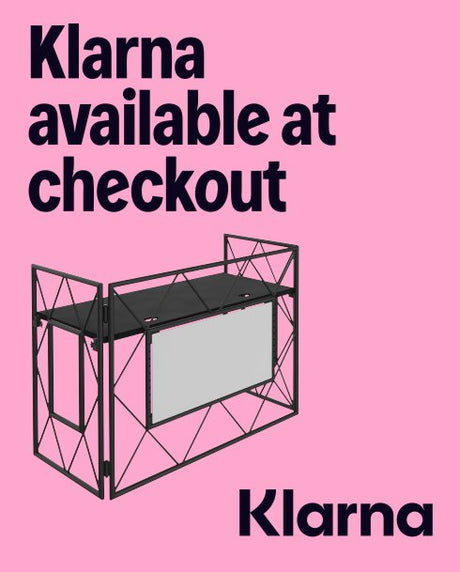 Black geometric desk on a pink background with 'Klarna' text.
